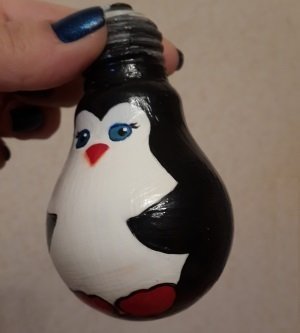 varnishing penguin on the light bulb