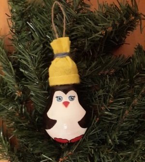 a cap on the penguin on the light bulb