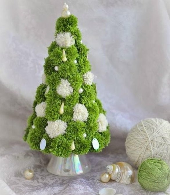 a beautiful Christmas tree made of pom-poms made with their own hands